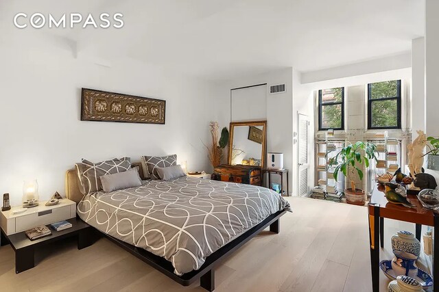 bedroom featuring wood finished floors
