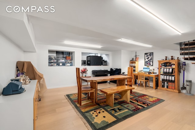 dining area with light wood-style flooring