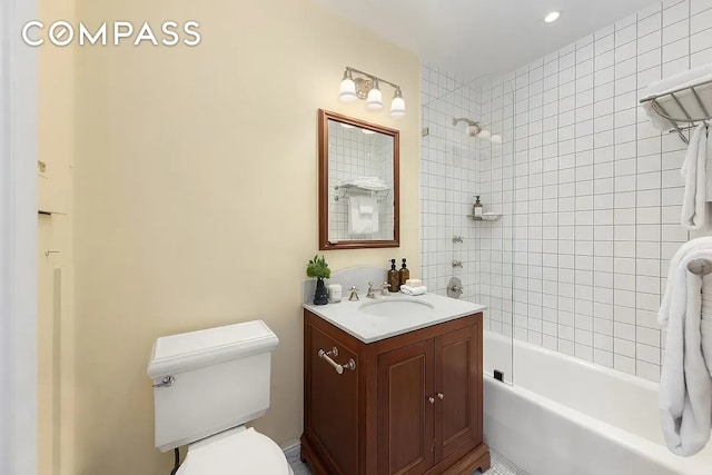 full bathroom featuring recessed lighting, vanity, toilet, and  shower combination