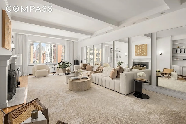 living area featuring a premium fireplace and beamed ceiling