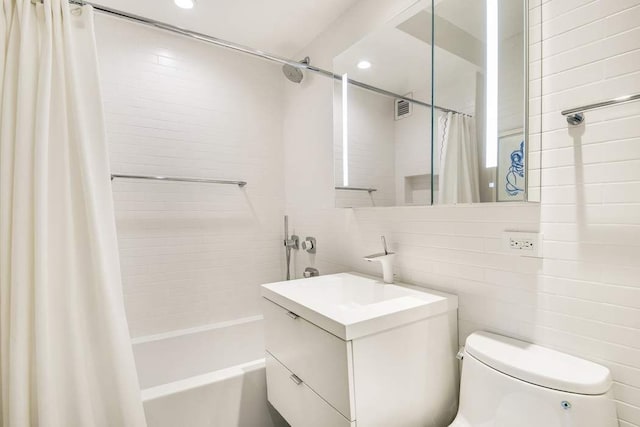 20 Sutton Pl S Unit 16/17Ef, New York City, NY 10022 - full bath featuring vanity, toilet, recessed lighting, tile walls, and shower / tub combo