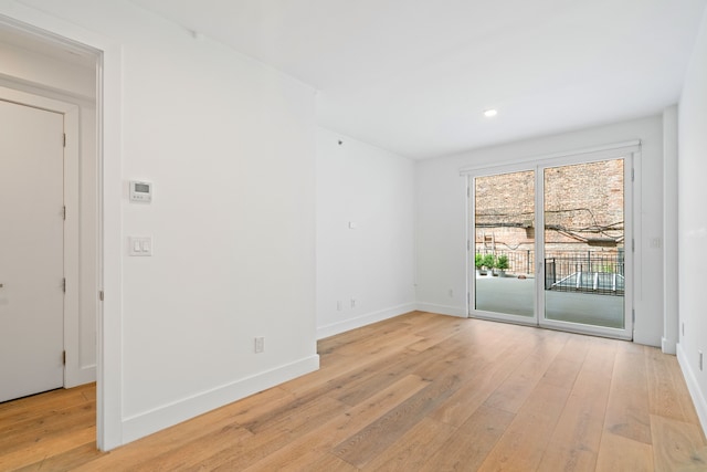 245 E 53rd St Unit 2, New York City, NY 10022 - empty room featuring light wood finished floors, baseboards, and recessed lighting
