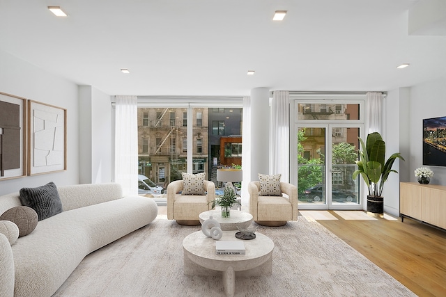 245 E 53rd St Unit 2, New York City, NY 10022 - living room with wood finished floors and plenty of natural light