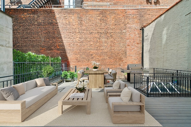 245 E 53rd St Unit 2, New York City, NY 10022 - view of patio with an outdoor hangout area, area for grilling, and a balcony
