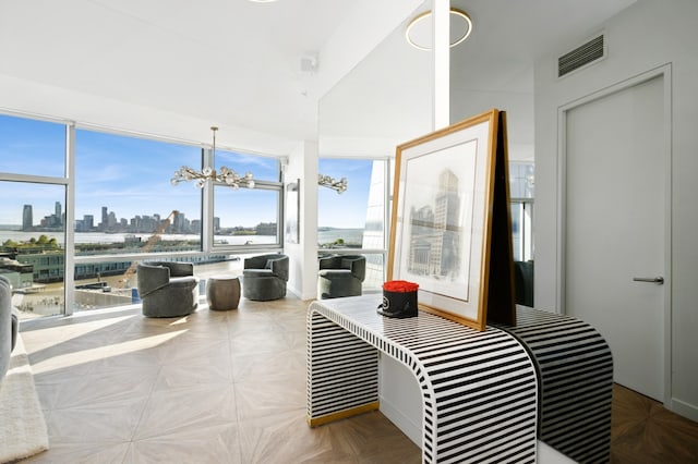 100 11th Ave Unit 12-B, New York City, NY 10011 - sunroom featuring a chandelier, vaulted ceiling, and a view of skyline