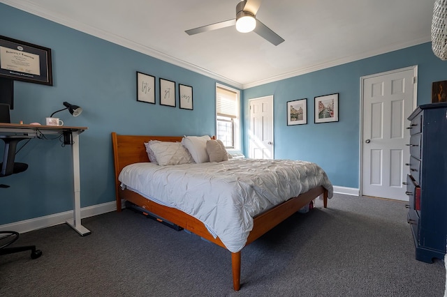carpeted bedroom featuring baseboards, ornamental molding, and a ceiling fan
