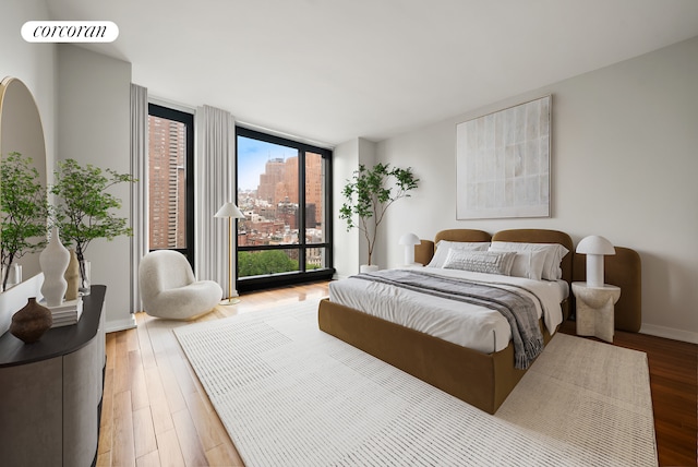 101 Warren St Unit 1720, New York City, NY 10007 - bedroom with floor to ceiling windows and wood finished floors