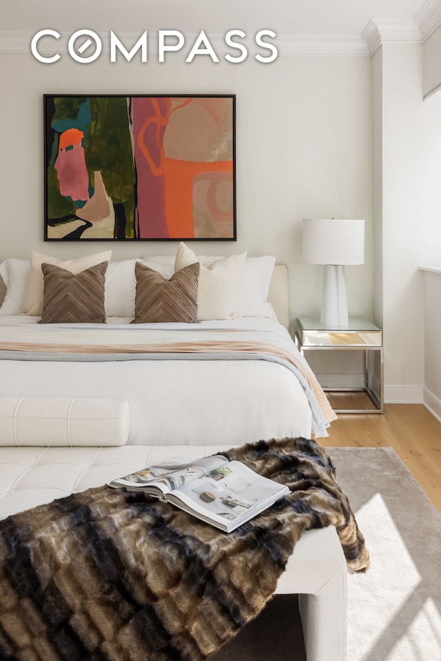 32 E 76th St Unit 805, New York City, NY 10021 - bedroom with ornamental molding and wood finished floors