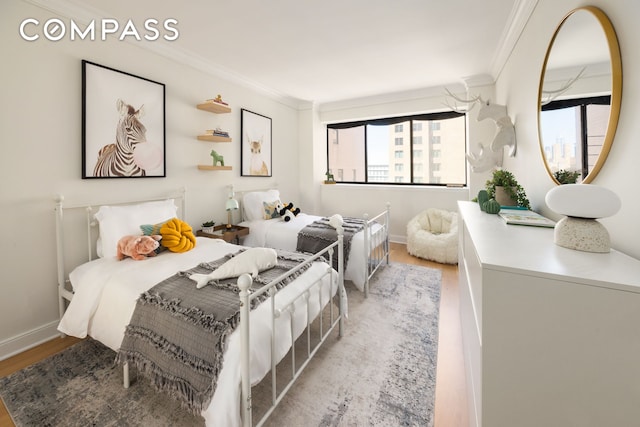 32 E 76th St Unit 805, New York City, NY 10021 - bedroom with ornamental molding and wood finished floors