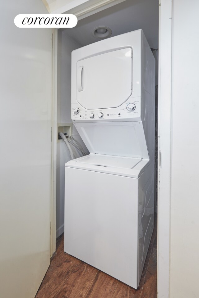 658 Park Pl Unit 1, New York City, NY 11216 - washroom with estacked washer and dryer and dark wood finished floors