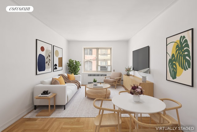 living room with visible vents, radiator, and baseboards