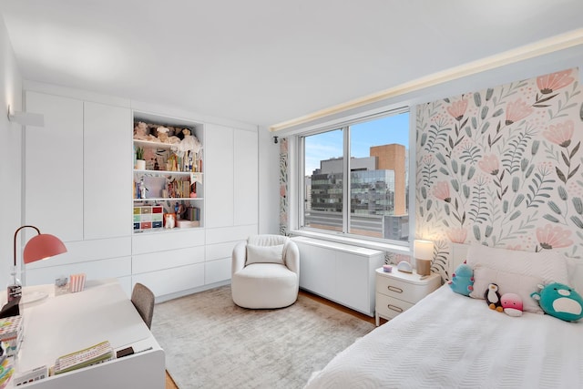 bedroom with wood finished floors