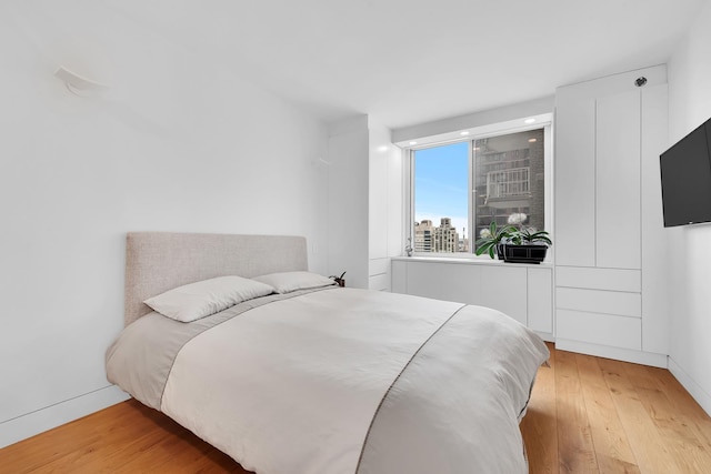 bedroom featuring recessed lighting and light wood finished floors