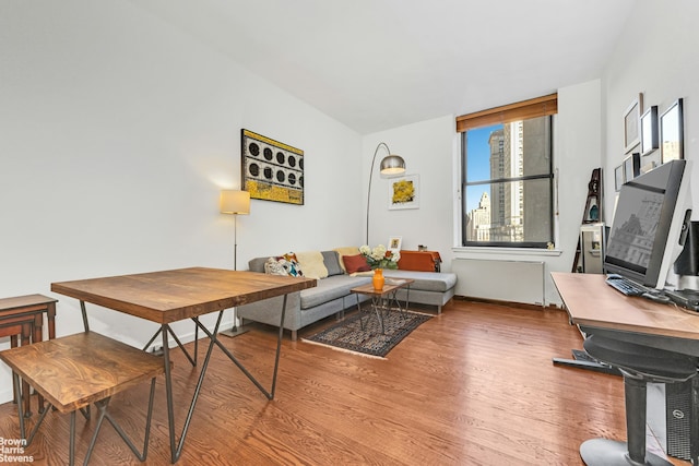 living room featuring wood finished floors and baseboards