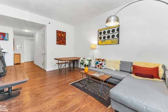 living room featuring wood finished floors and baseboards