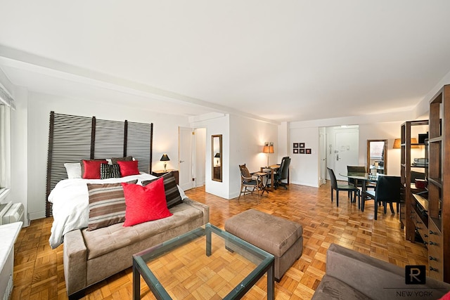 240 E 55th St Unit 5-C, New York City, NY 10022 - living room featuring baseboards