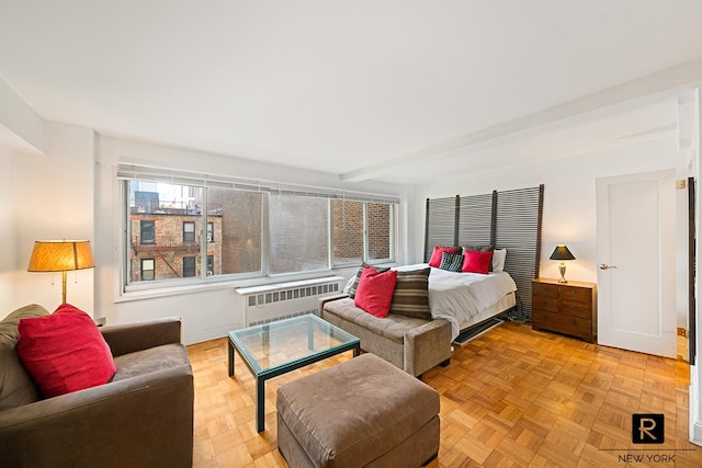240 E 55th St Unit 5-C, New York City, NY 10022 - bedroom featuring radiator and baseboards