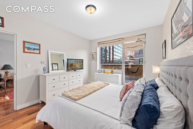 2-40 51st Ave Unit 2N, New York City, NY 11101 - bedroom with wood finished floors and baseboards