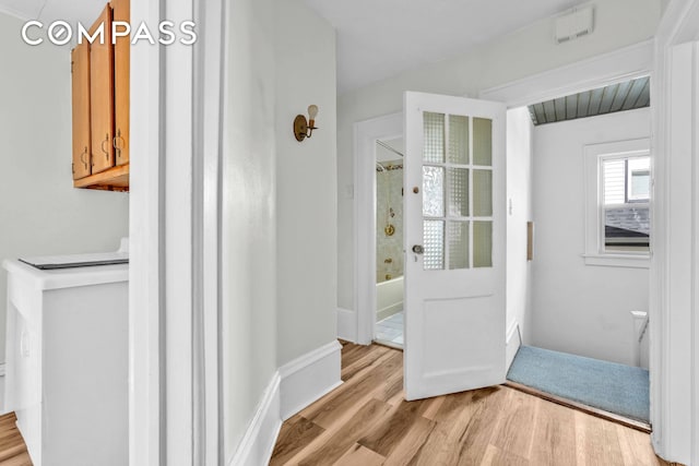doorway to outside featuring light wood-style floors