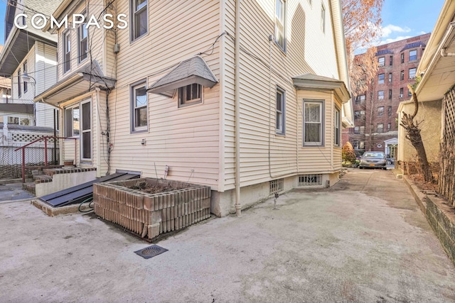 view of yard with fence, entry steps, and a patio