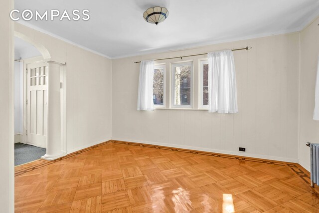 642 E 26th St, New York City, NY 11210 - spare room with decorative columns, baseboards, and arched walkways