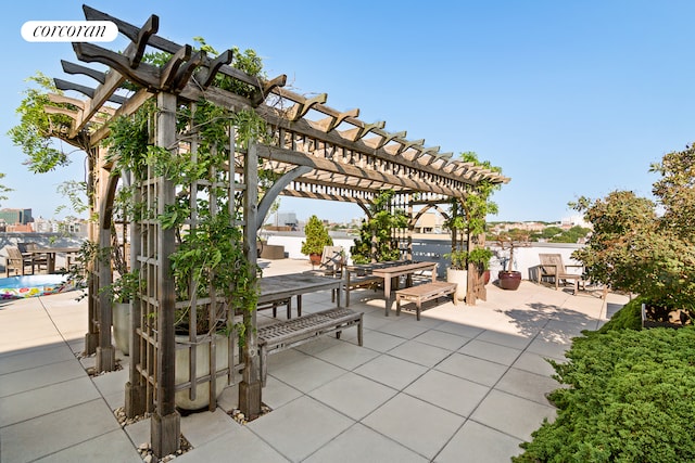 view of patio / terrace with a pergola and outdoor dining space
