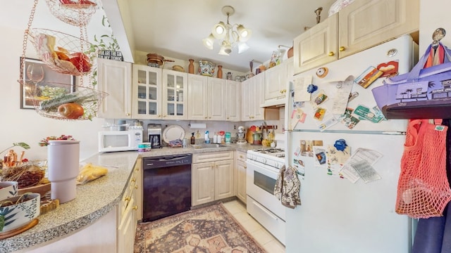 kitchen with white appliances, glass insert cabinets, light countertops, a sink, and light tile patterned floors
