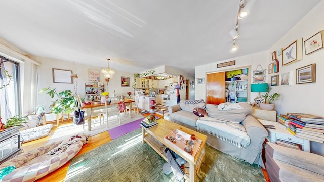 living area with an inviting chandelier