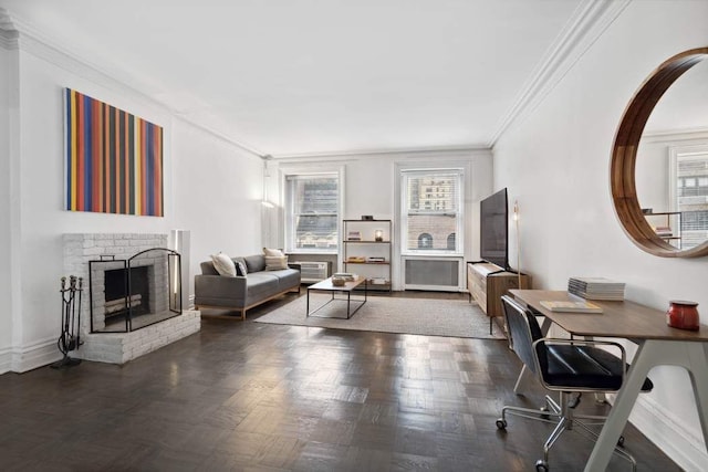 living area featuring crown molding, baseboards, a fireplace, and a wealth of natural light
