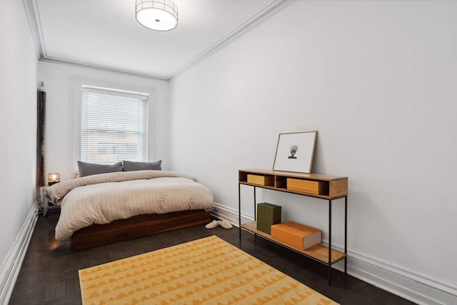 bedroom featuring baseboards and ornamental molding