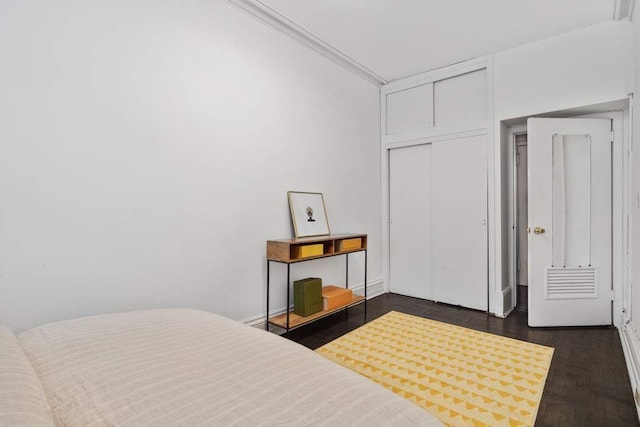 bedroom with a closet and baseboards