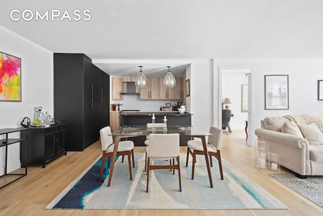 dining space with light wood-style floors