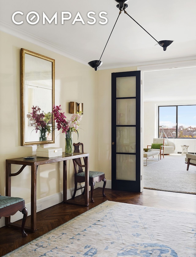 foyer featuring ornamental molding