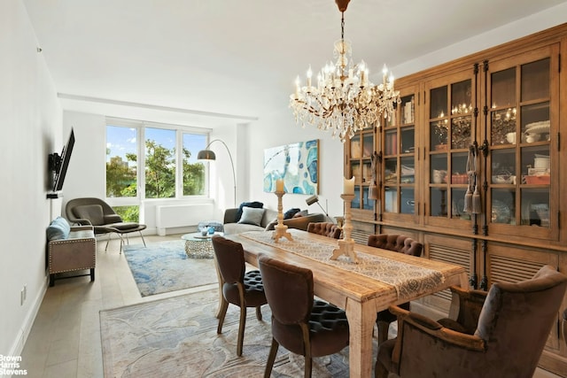 120 Riverside Blvd Unit 3N, New York City, NY 10069 - dining space with a chandelier and light wood-style flooring