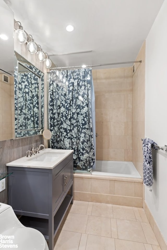 120 Riverside Blvd Unit 3N, New York City, NY 10069 - bathroom featuring tiled shower / bath, vanity, tile patterned floors, and recessed lighting
