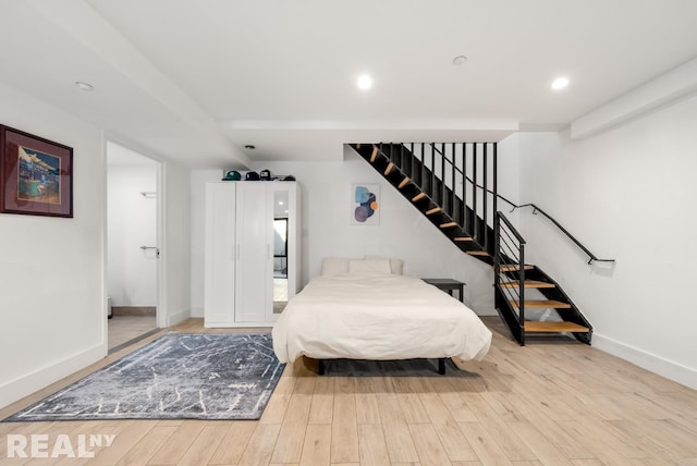 143 Meserole St Unit 1A, New York City, NY 11206 - bedroom featuring baseboards, wood finished floors, and recessed lighting