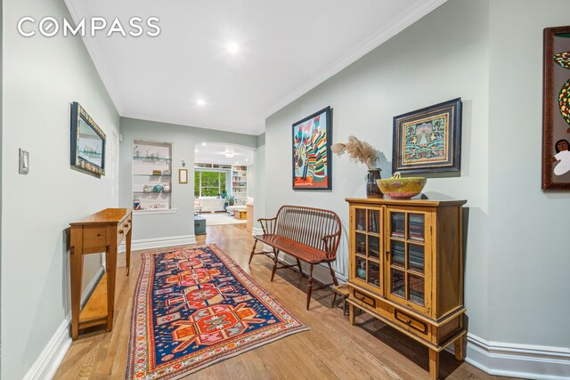525 E 89th St Unit 3A, New York City, NY 10128 - hallway featuring ornamental molding, wood finished floors, baseboards, and recessed lighting
