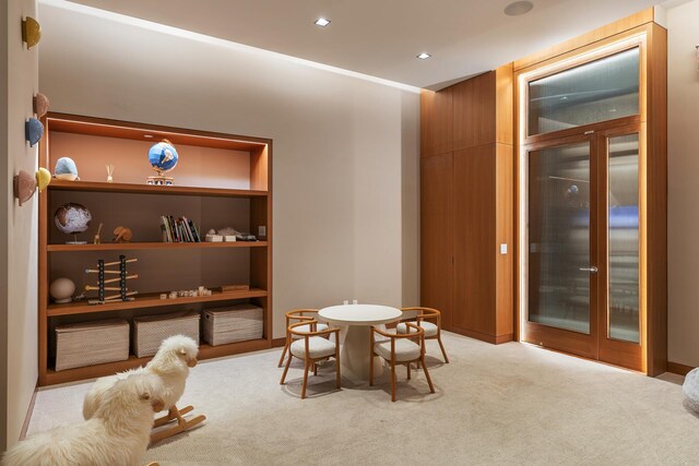 611 W 56th St Unit 12, New York City, NY 10019 - carpeted dining room with recessed lighting and built in features