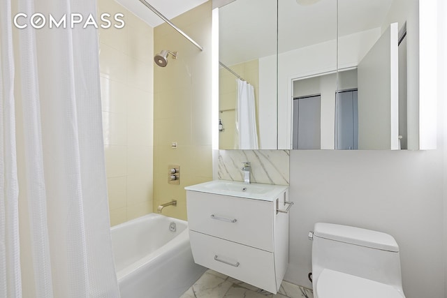 450 W 17th St Unit 2302, New York City, NY 10011 - full bathroom featuring toilet, marble finish floors, shower / bath combo, and vanity