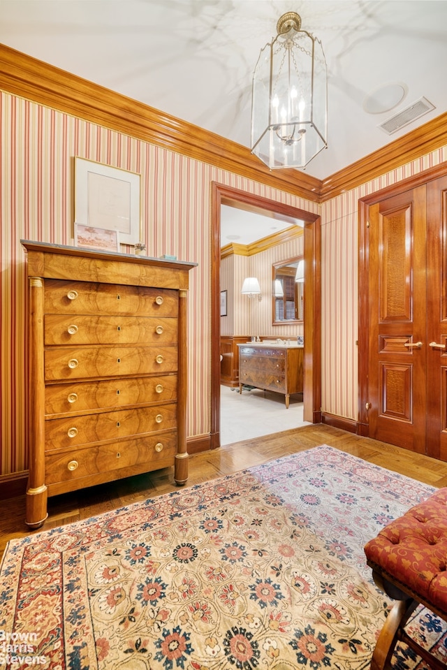 bedroom featuring a chandelier and ornamental molding