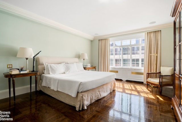 bedroom featuring ornamental molding and baseboards