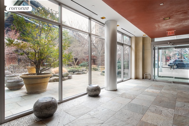 lobby with a wall of windows and a high ceiling