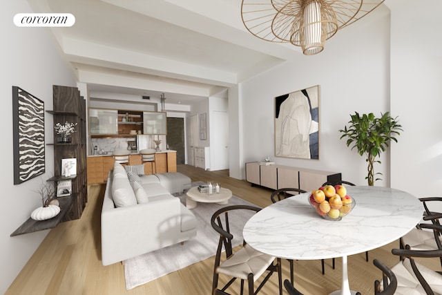 living area with light wood-style flooring and a chandelier