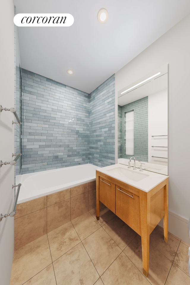 bathroom featuring tile patterned floors, a relaxing tiled tub, vanity, and recessed lighting
