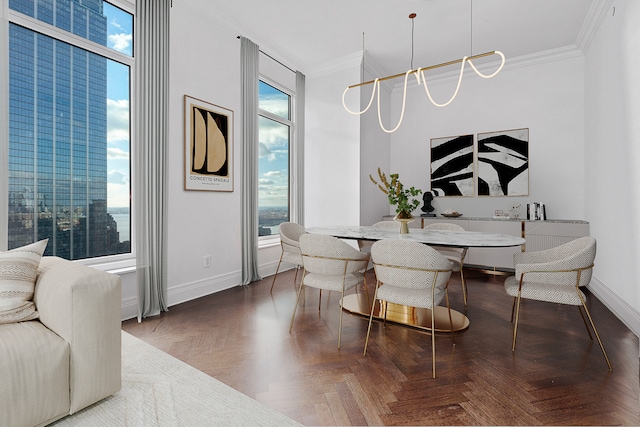 dining area featuring plenty of natural light, baseboards, and ornamental molding