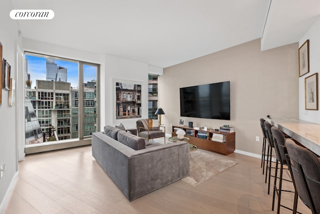 500 W 18th St Unit W9D, New York City, NY 10011 - living room with baseboards, wood finished floors, and visible vents