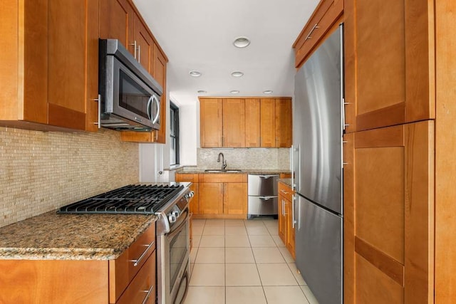 260 W End Ave Unit 3D, New York City, NY 10023 - kitchen with stainless steel appliances, a sink, brown cabinets, light tile patterned floors, and recessed lighting