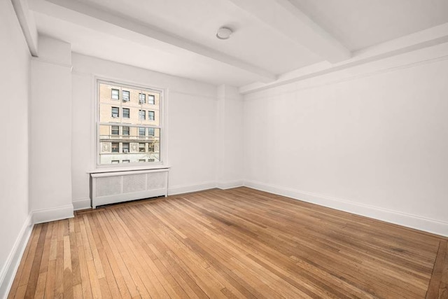 260 W End Ave Unit 3D, New York City, NY 10023 - unfurnished room with beam ceiling, light wood-style flooring, baseboards, and radiator