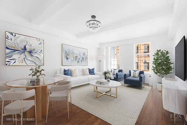 living room with wood finished floors and beam ceiling