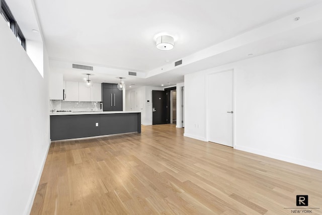 873 Pacific St Unit 2-B, New York City, NY 11238 - unfurnished living room featuring light wood-style flooring and baseboards